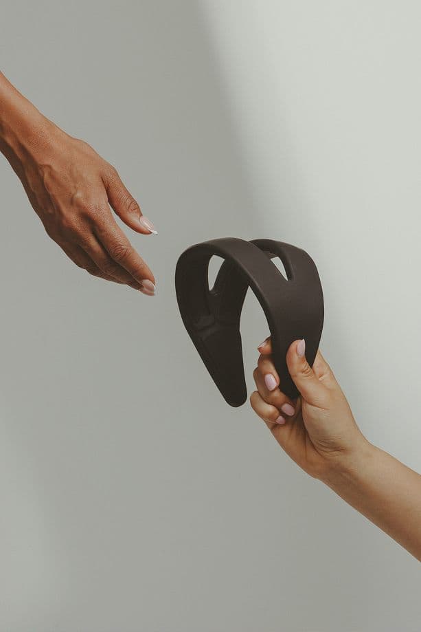 Hands reaching out for Samphire wearable device